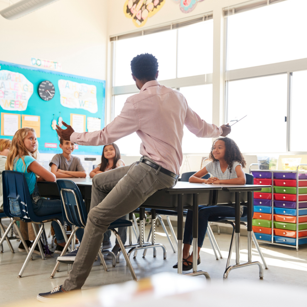 teacher teaching to kids in classroom