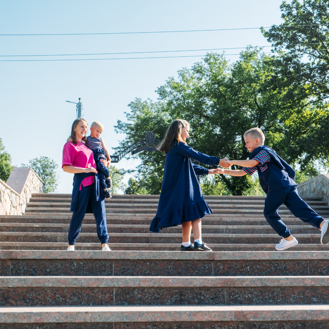 group of kids dancing on stairs