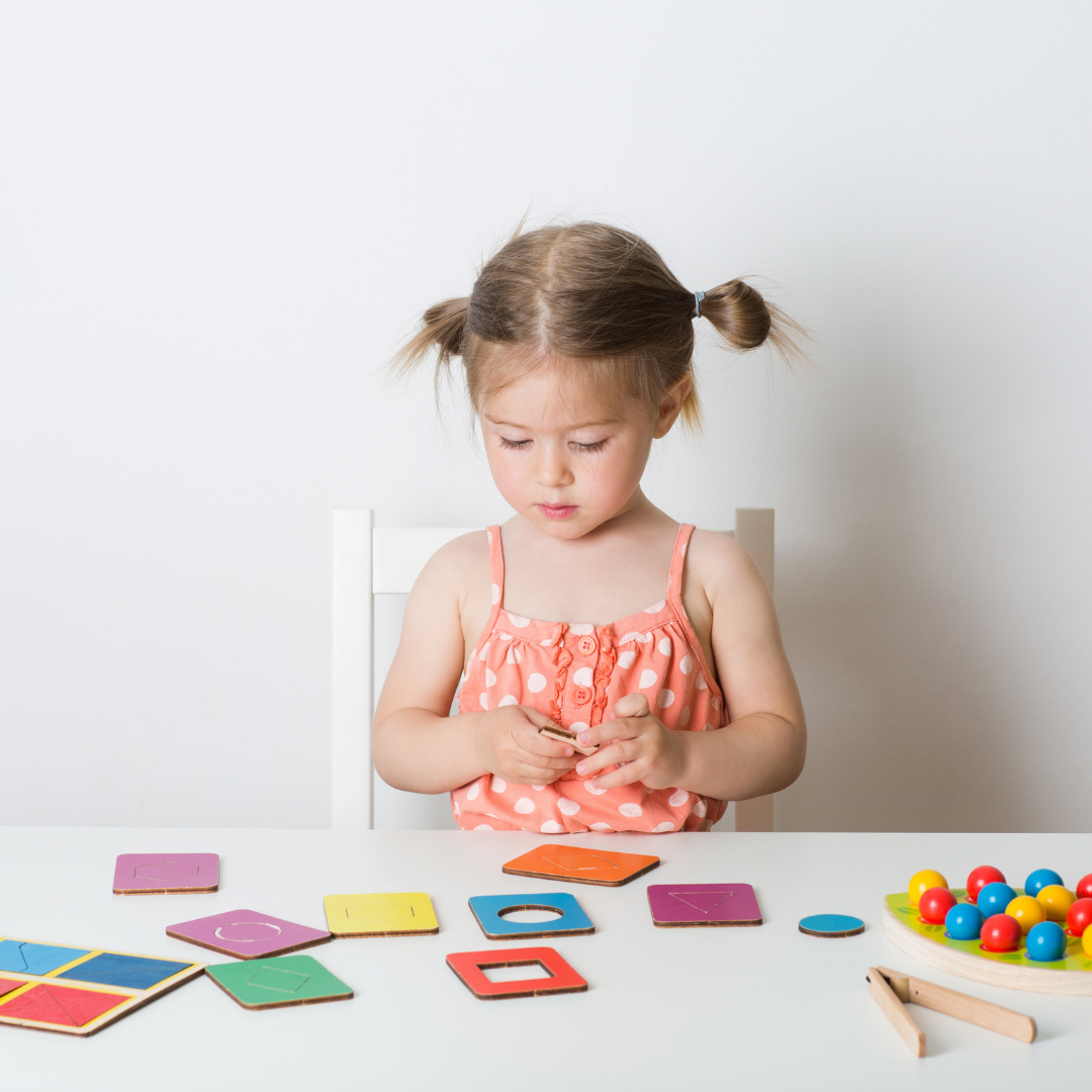 young girl solving puzzle with white background
