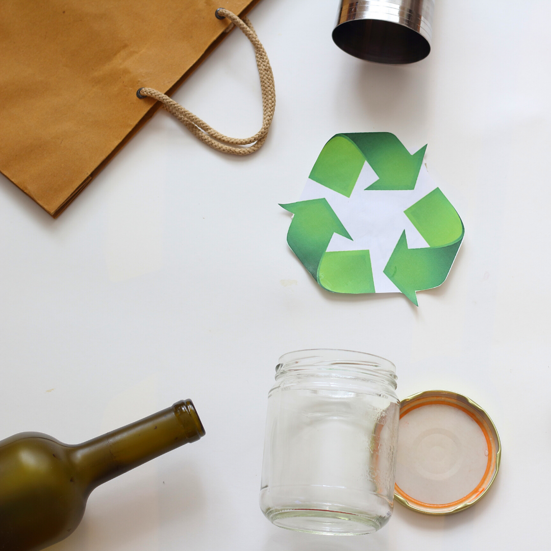 Recycled bottles and bags and the recycling logo