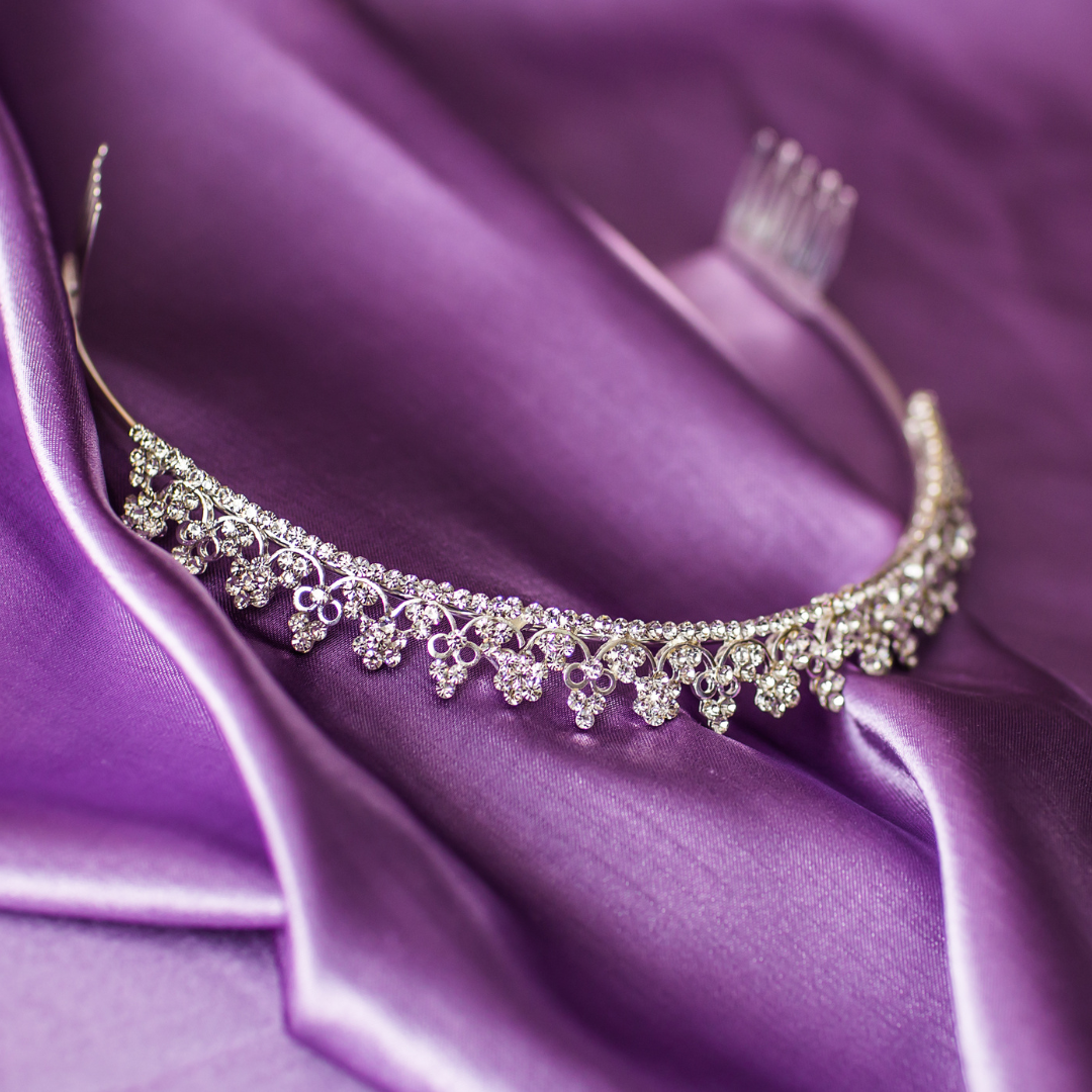 crown on purple cloth