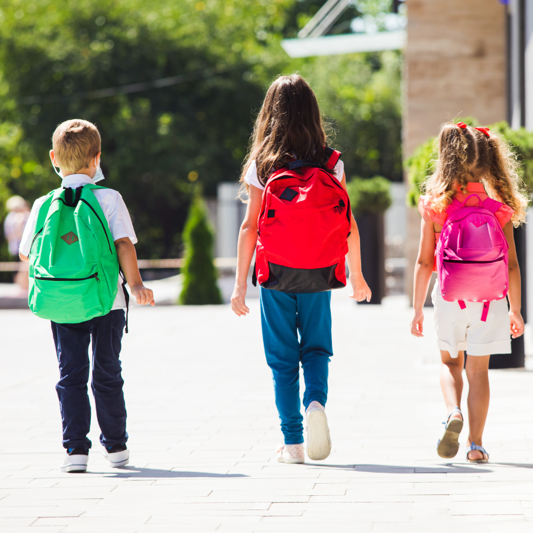 three children walking to school