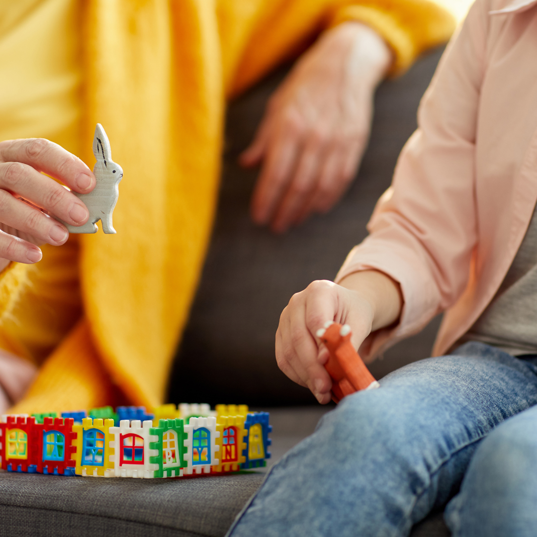 Old Woman playing with little girl