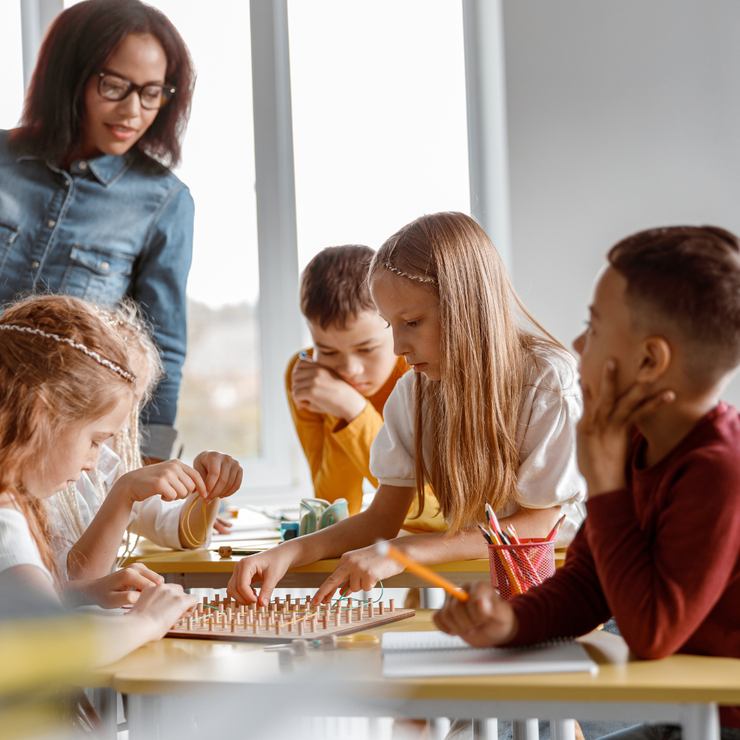 Teacher talking to students in a classroom