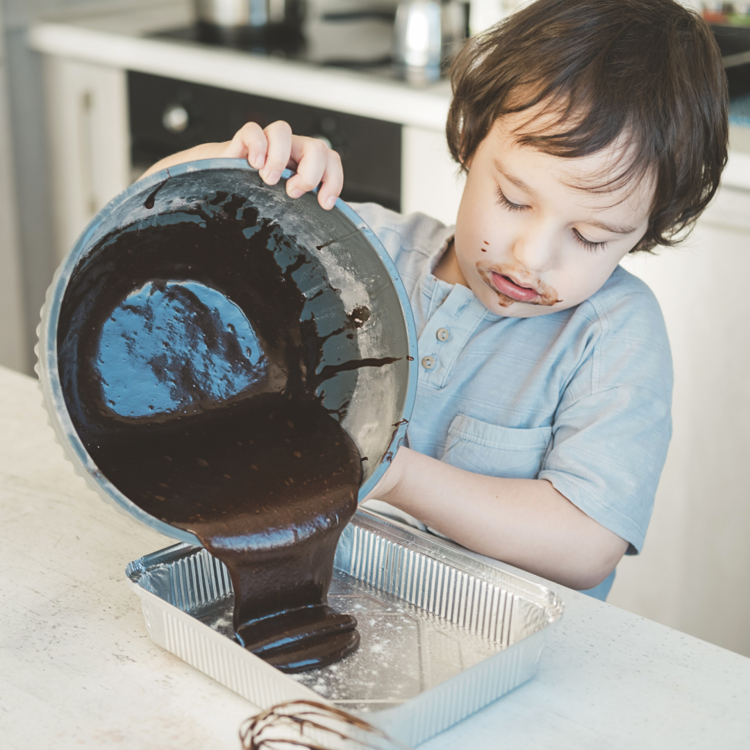Child cooking chocolate in kitchen